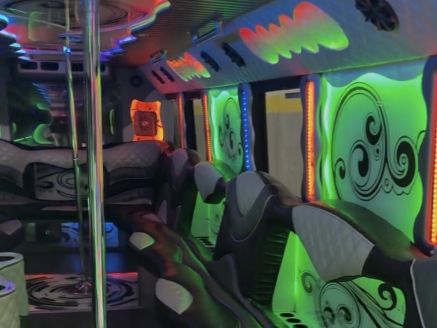 Party bus interior with dance floor, pole and LED lighting