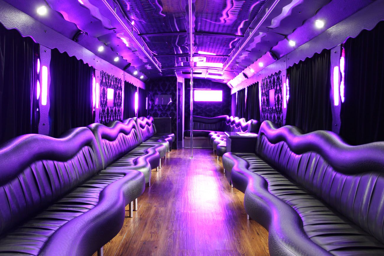 Party bus interior with purple lighting